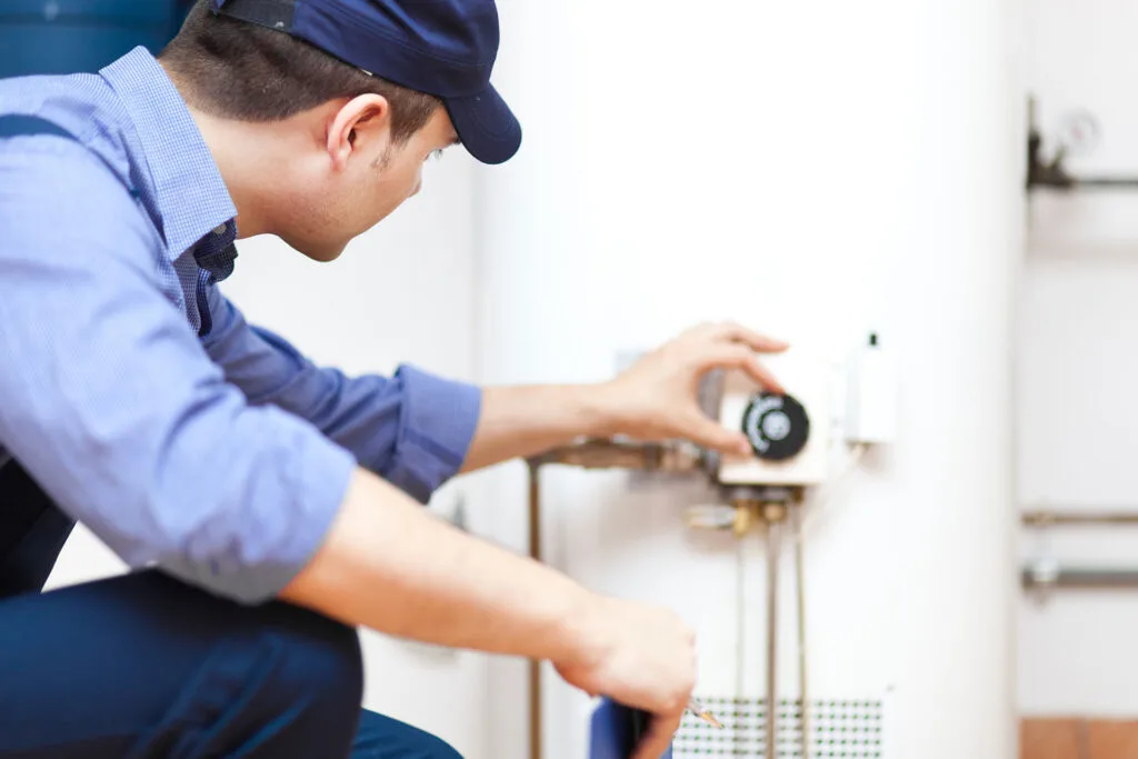 plumber repairing a water heater